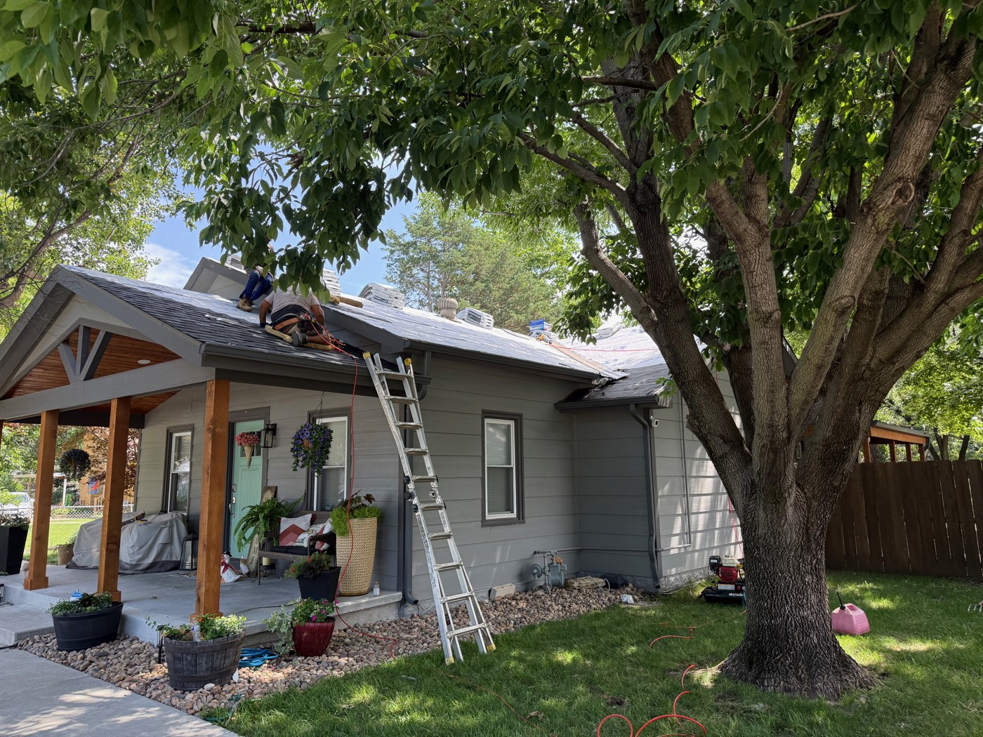 Roof tear-off in progress on a Wichita bungalow