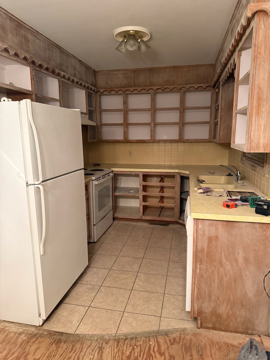 Kitchen before cabinet painting, cabinets stripped and prepped